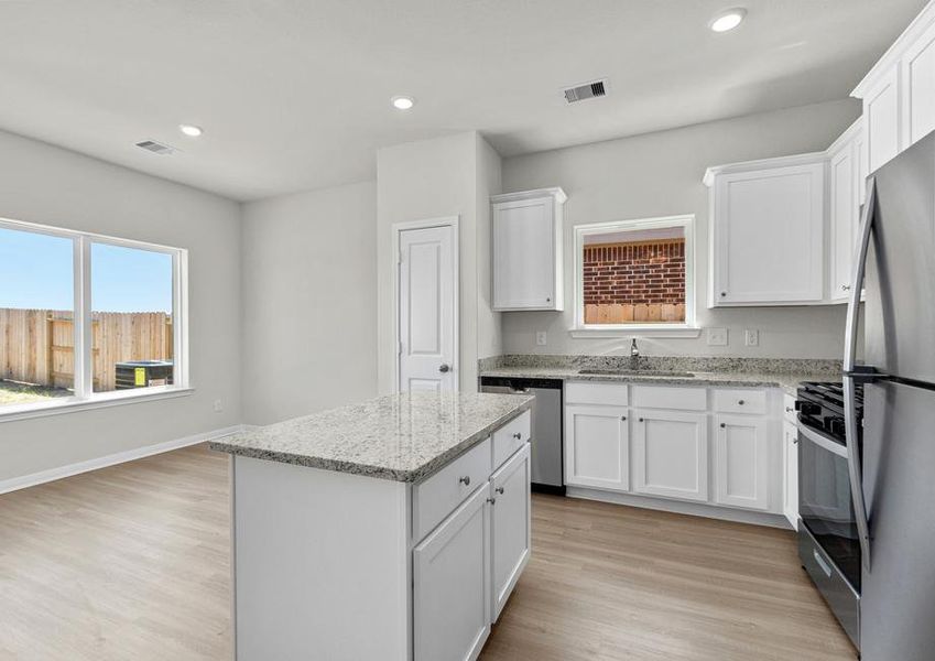 The kitchen island features extra storage you will appreciate