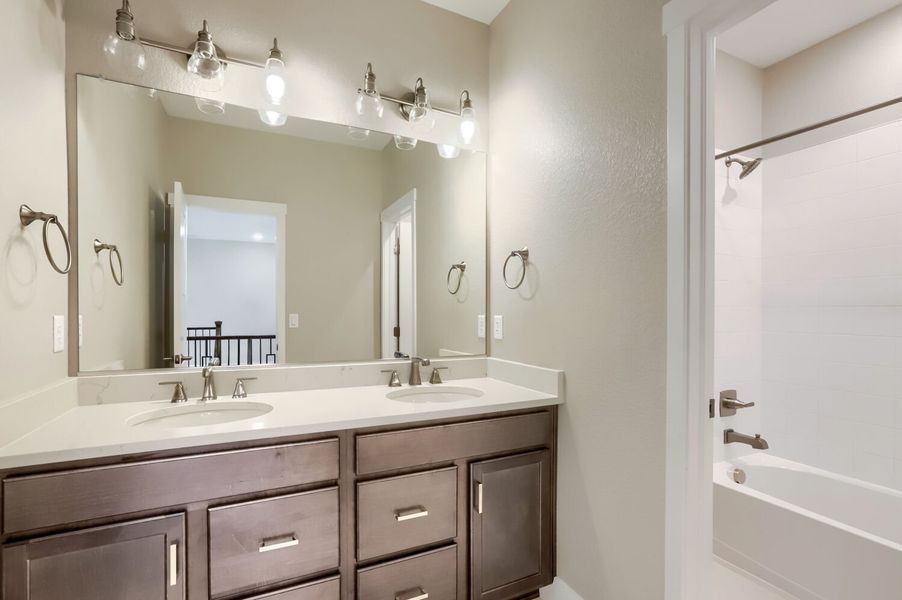 Furnished interior view inside a new home in Barefoot, Firestone (Image 5).