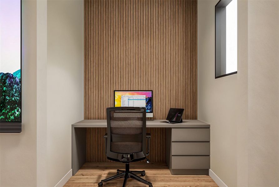 Home office area with built in drawers and table top.