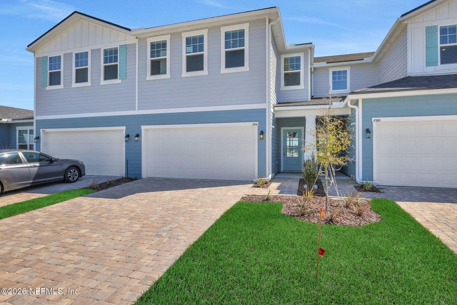 Front exterior of a new home in Brook Forest, St. Augustine, FL, highlighting curb appeal (Image 2). Front exterior of a new home in Brook Forest, St. Augustine, FL, highlighting curb appeal (Image 2).
