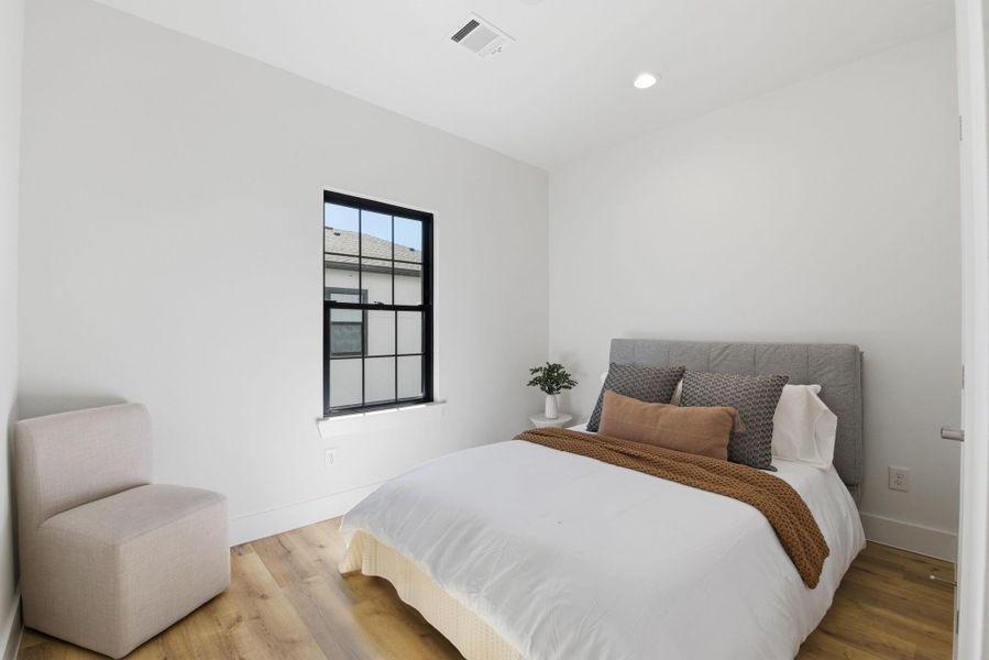 Well-sized secondary bedroom, ideal for family members or guests.