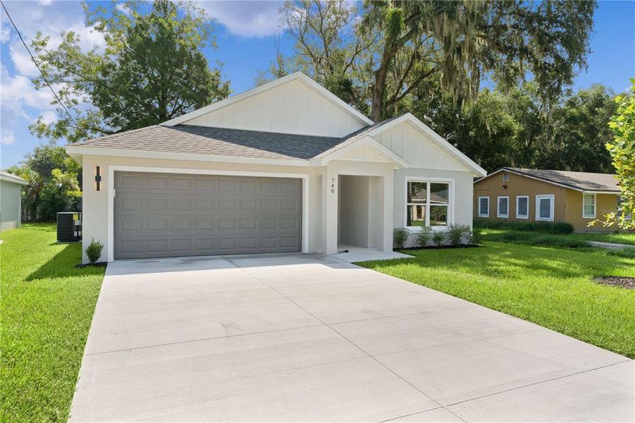 Front exterior of a new home in , Ocklawaha, FL, highlighting curb appeal (Image 20).
