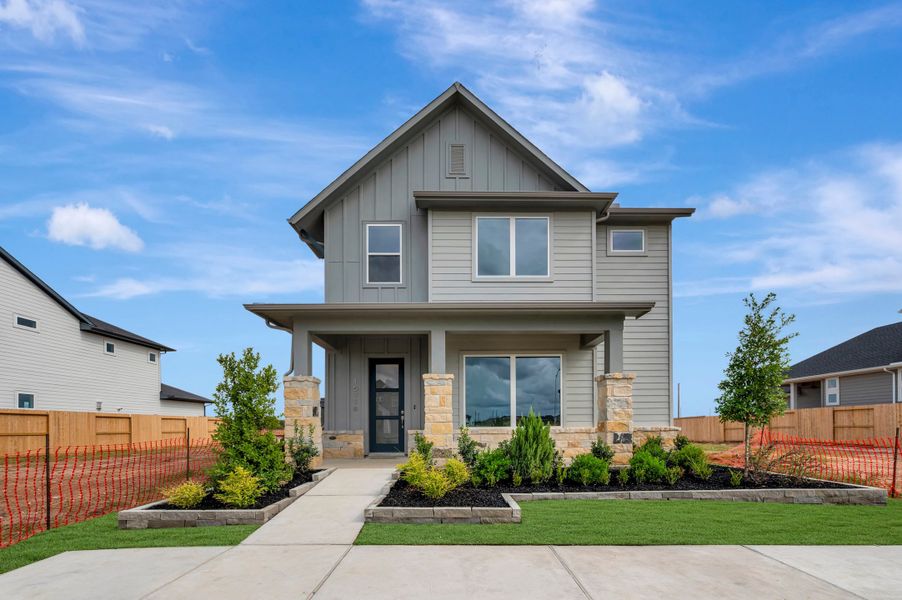 Front exterior of a new home in Jubilee - Grove Row Collection, Hockley, TX, highlighting curb appeal (Image 2). Front exterior of a new home in Jubilee - Grove Row Collection, Hockley, TX, highlighting curb appeal (Image 2).