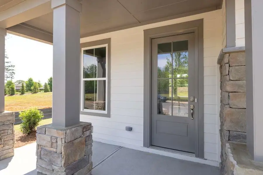 Exterior details and patio area of a home in Maddox Landing, Hoschton (Image 4).
