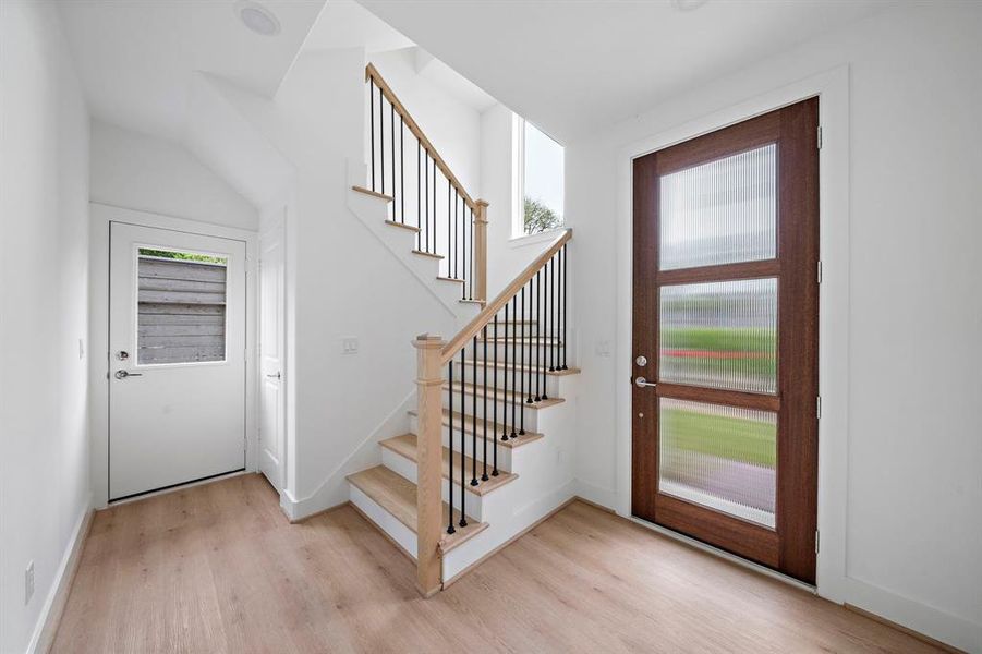 The Claudia has a side entrance with a modern door, and open foyer. The study and one of the three bedrooms is located on this floor.