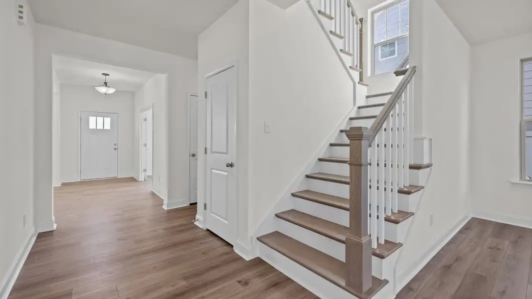 Norris Design wide entry and stairs with solid oak treads and open rail. At Lakeside Glen by DRB Homes in York, SC. Norris Design wide entry and stairs with solid oak treads and open rail. At Lakeside Glen by DRB Homes in York, SC.