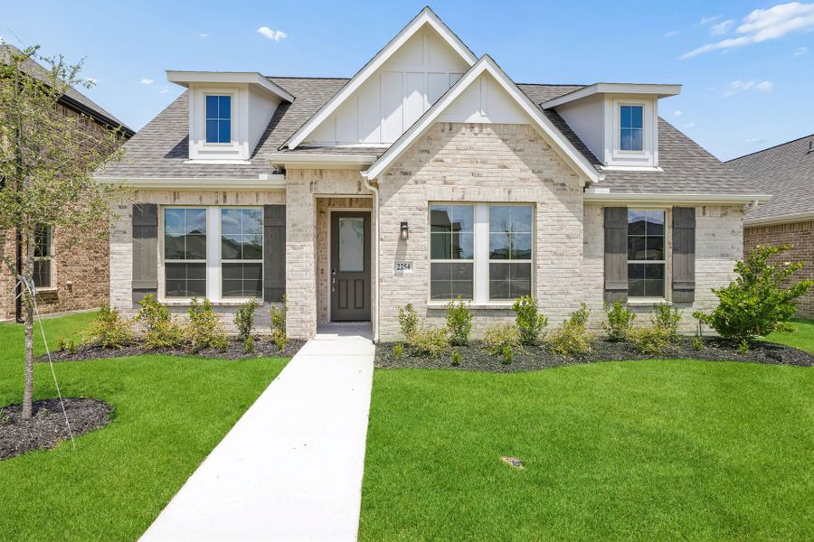 Front exterior of a new home in Dove Hollow, Waxahachie, TX, highlighting curb appeal (Image 1). Front exterior of a new home in Dove Hollow, Waxahachie, TX, highlighting curb appeal (Image 1).