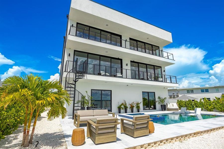 Front exterior of a new home in , Madeira Beach, FL, highlighting curb appeal (Image 28). Front exterior of a new home in , Madeira Beach, FL, highlighting curb appeal (Image 28).