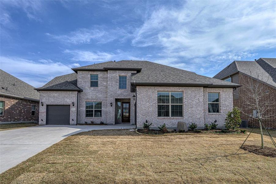Front exterior of a new home in Estates at Baker Park, Sherman, TX, highlighting curb appeal (Image 26).
