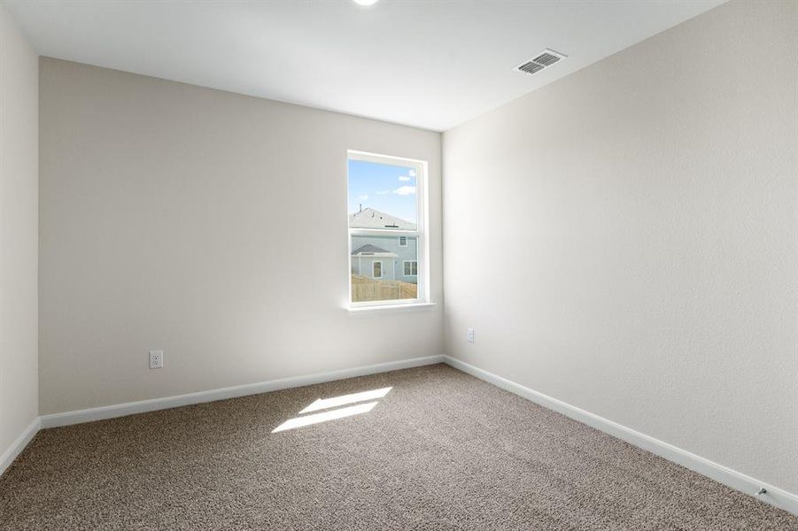 Empty room with baseboards and carpet