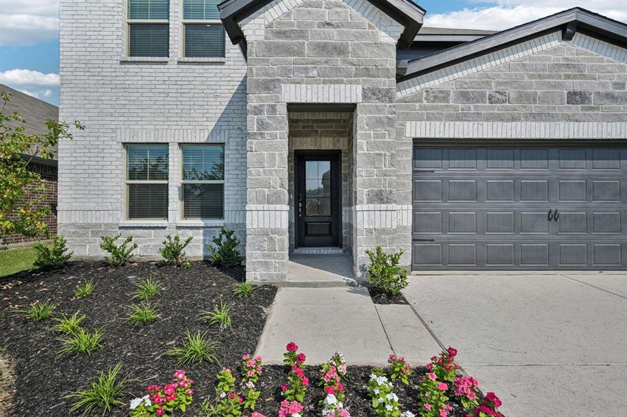 Front exterior of a new home in Lakehaven - Signature Series, Farmersville, TX, highlighting curb appeal (Image 22). Front exterior of a new home in Lakehaven - Signature Series, Farmersville, TX, highlighting curb appeal (Image 22).