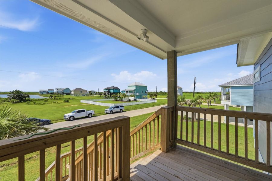 Charming coastal retreat with a spacious wooden deck offering serene views of lush greenery and nearby water, perfect for relaxation and enjoying the tranquil surroundings. Charming coastal retreat with a spacious wooden deck offering serene views of lush greenery and nearby water, perfect for relaxation and enjoying the tranquil surroundings.
