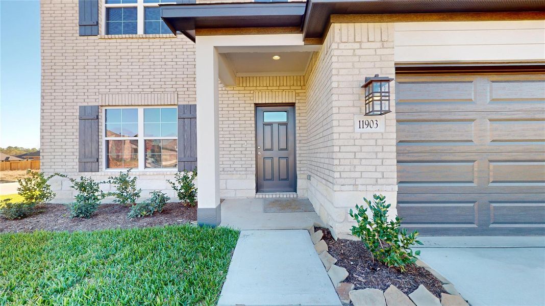 Exterior details and patio area of a home in Lexington Heights 50', Willis (Image 2).