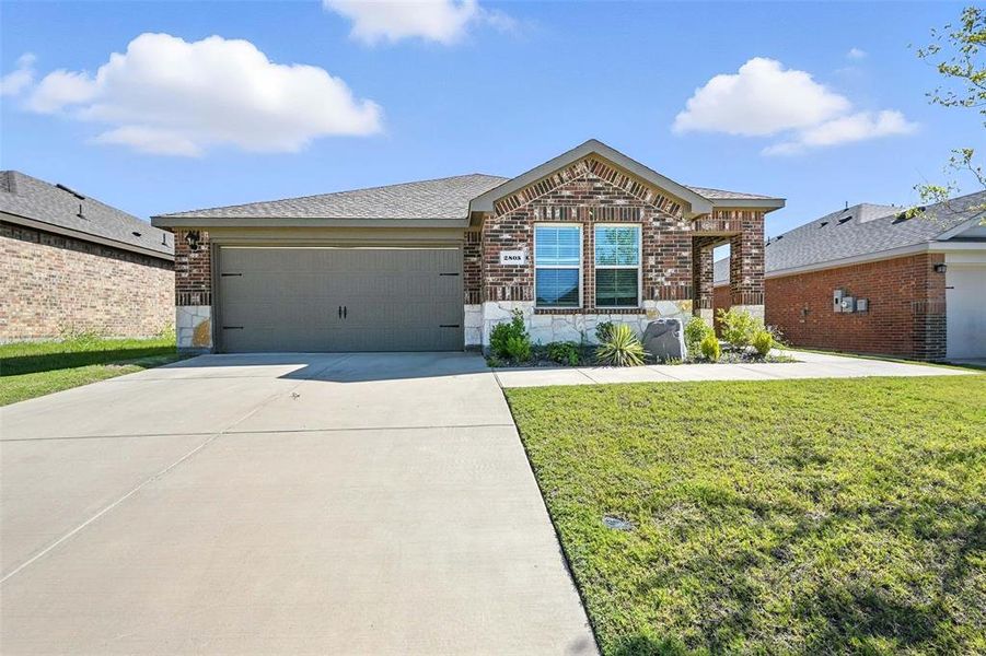 Front exterior of a new home in , Sherman, TX, highlighting curb appeal (Image 1).