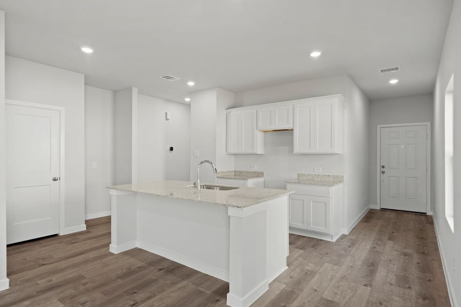 A kitchen with white cabinets. A kitchen with white cabinets.