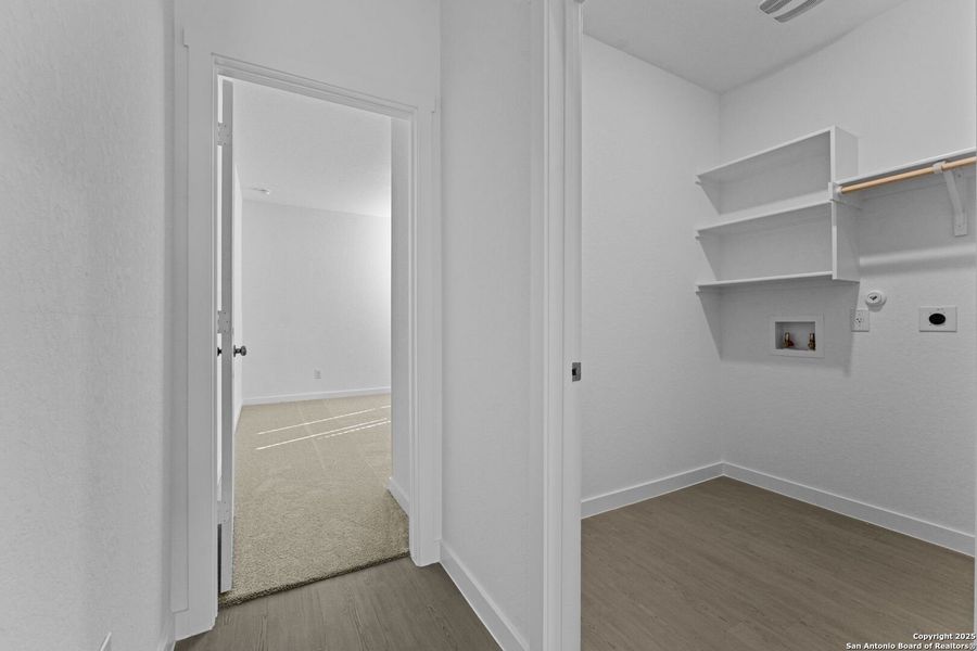 Spacious, unfurnished interior of a new home in Waterwheel: Coastline Collection, San Antonio (Image 17).