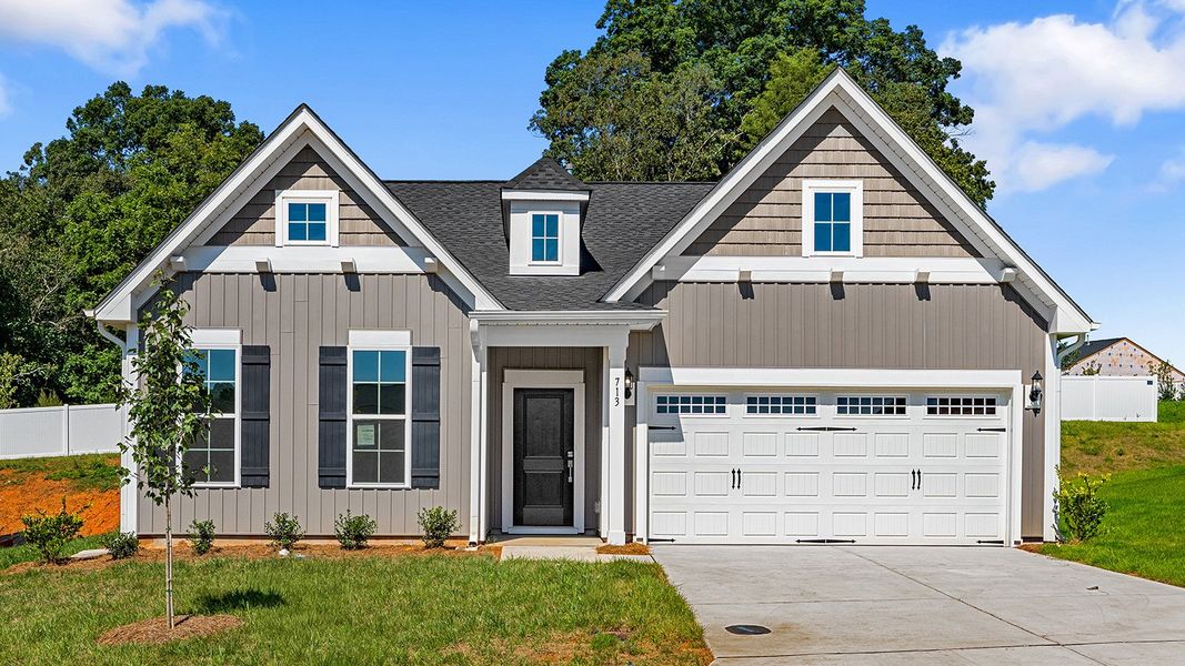 Front exterior of a new home in Hanes Lake, Winston-Salem, NC, highlighting curb appeal (Image 1).