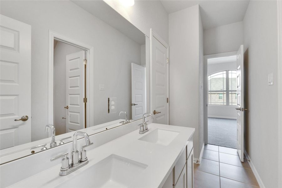 Full bath with tile patterned floors and double vanity Full bath with tile patterned floors and double vanity