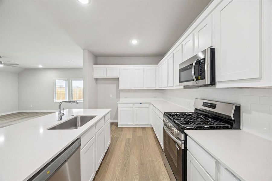 Kitchen in the Hayden home plan by Trophy Signature Homes – REPRESENTATIVE PHOTO Kitchen in the Hayden home plan by Trophy Signature Homes – REPRESENTATIVE PHOTO