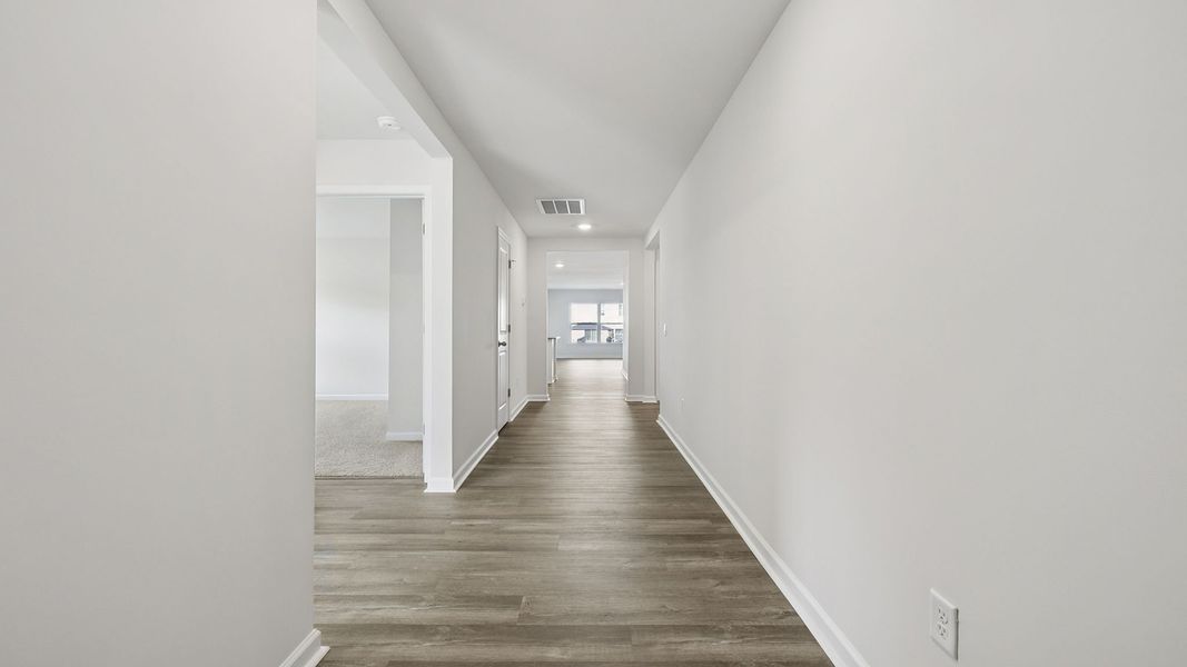 Spacious, unfurnished interior of a new home in Bentley Park, Greenwood (Image 10).