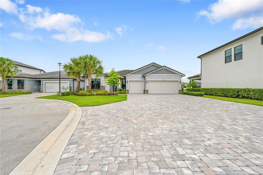 Front exterior of a new home in Oak Tree, Oakland Park, FL, highlighting curb appeal (Image 2).