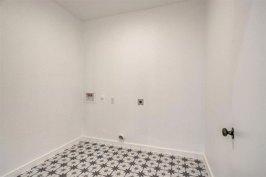 Laundry room featuring washer hookup, hookup for a gas dryer, and hookup for an electric dryer Laundry room featuring washer hookup, hookup for a gas dryer, and hookup for an electric dryer