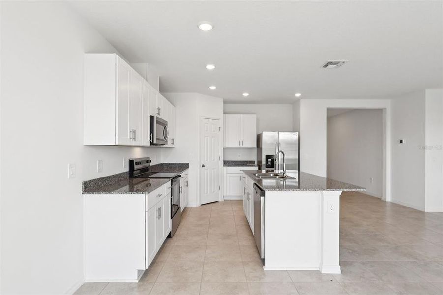 Furnished interior view inside a new home in Deer Run at Crosswinds, Davenport (Image 6).