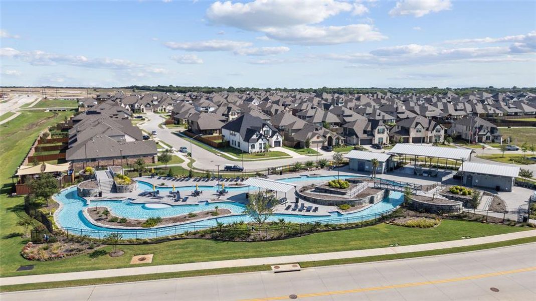 Aerial view of residential area featuring a pool area