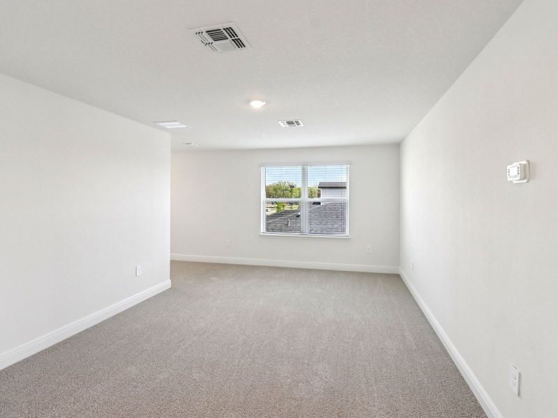 Spacious, unfurnished interior of a new home in The Reserve at Hammock Oaks - Classic Series, Lady Lake (Image 11). Spacious, unfurnished interior of a new home in The Reserve at Hammock Oaks - Classic Series, Lady Lake (Image 11).