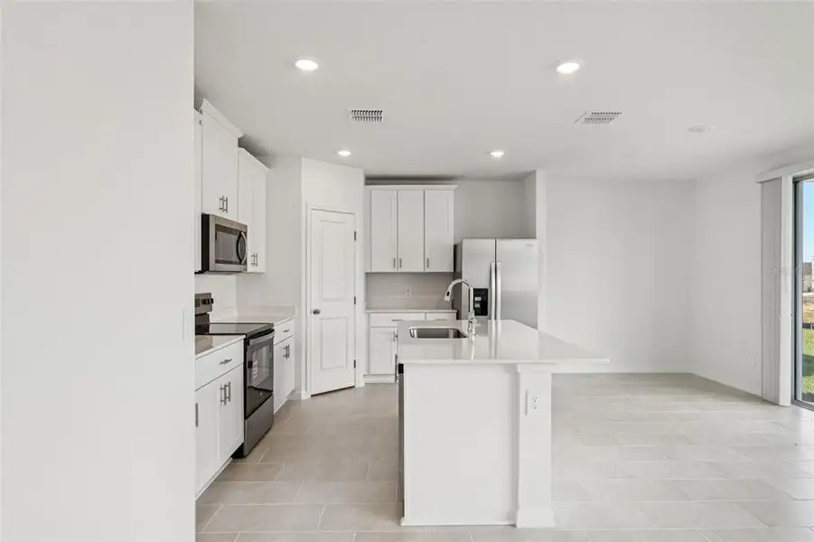 Furnished interior view inside a new home in Crosswinds - Classic Series, Haines City (Image 7). Furnished interior view inside a new home in Crosswinds - Classic Series, Haines City (Image 7).