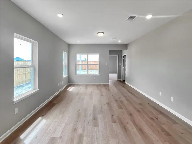 The Oakshire II- Dining Area into the Family Room. Home under construction.  Sample image for illustration; upgrades, options, and colors may vary.