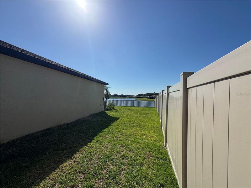 Exterior details and patio area of a home in Prosperity Lakes, Parrish (Image 22).