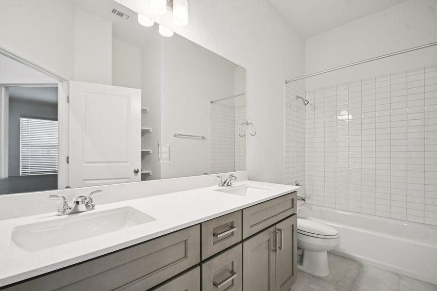 Furnished interior view inside a new home in Crosswinds, Kyle (Image 8).