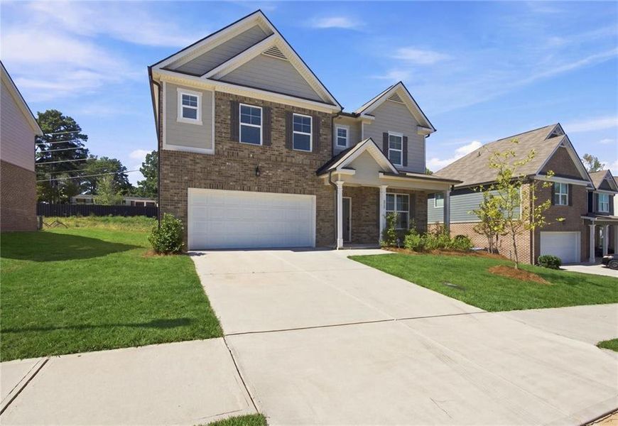 Front exterior of a new home in , Lawrenceville, GA, highlighting curb appeal (Image 2). Front exterior of a new home in , Lawrenceville, GA, highlighting curb appeal (Image 2).