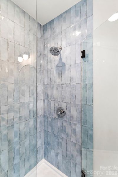 This walk-in shower has pretty tile and lots of space.
