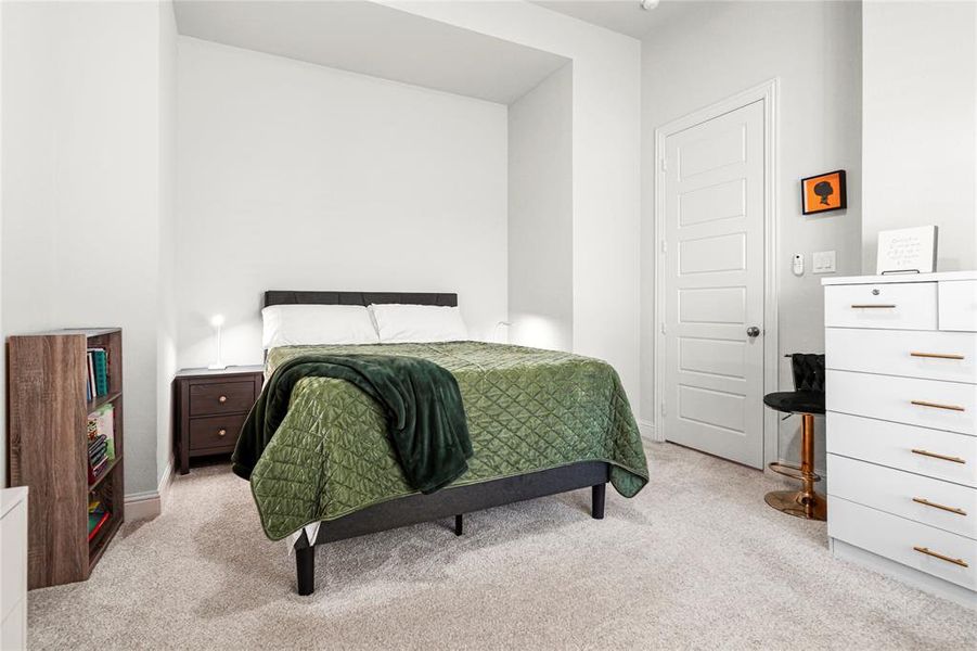 Bedroom with light carpet Bedroom with light carpet