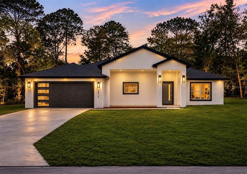 Front exterior of a new home in , Citrus Springs, FL, highlighting curb appeal (Image 21). Front exterior of a new home in , Citrus Springs, FL, highlighting curb appeal (Image 21).