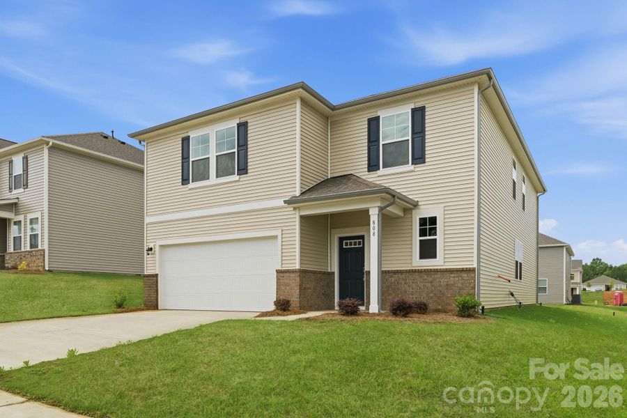 Front exterior of a new home in Carpenter Farms, Lincolnton, NC, highlighting curb appeal (Image 2). Front exterior of a new home in Carpenter Farms, Lincolnton, NC, highlighting curb appeal (Image 2).
