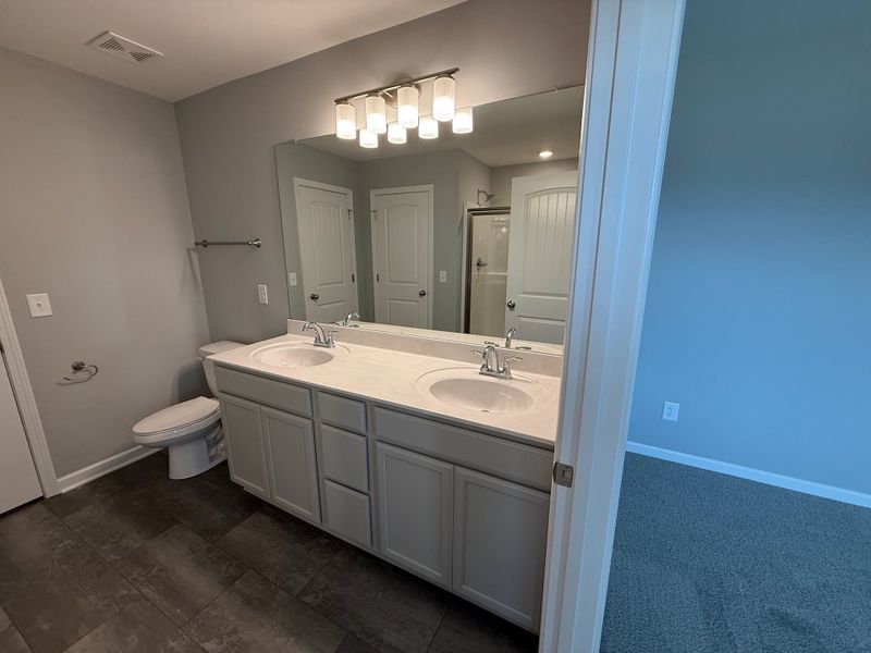 primary bathroom with double sinks