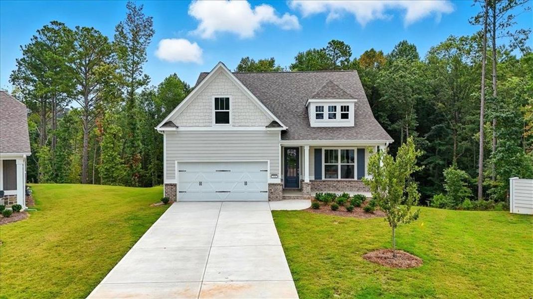 Front exterior of a new home in Stratford at NatureWalk, Dallas, GA, highlighting curb appeal (Image 2). Front exterior of a new home in Stratford at NatureWalk, Dallas, GA, highlighting curb appeal (Image 2).
