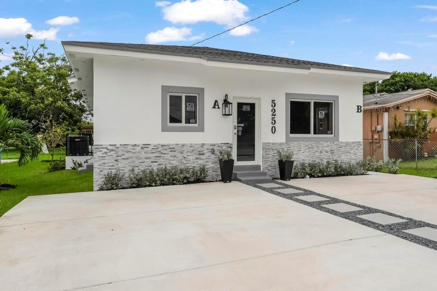 Front exterior of a new home in , West Park, FL, highlighting curb appeal (Image 18).
