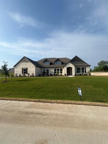Stone exterior with dark wood trim accents Stone exterior with dark wood trim accents