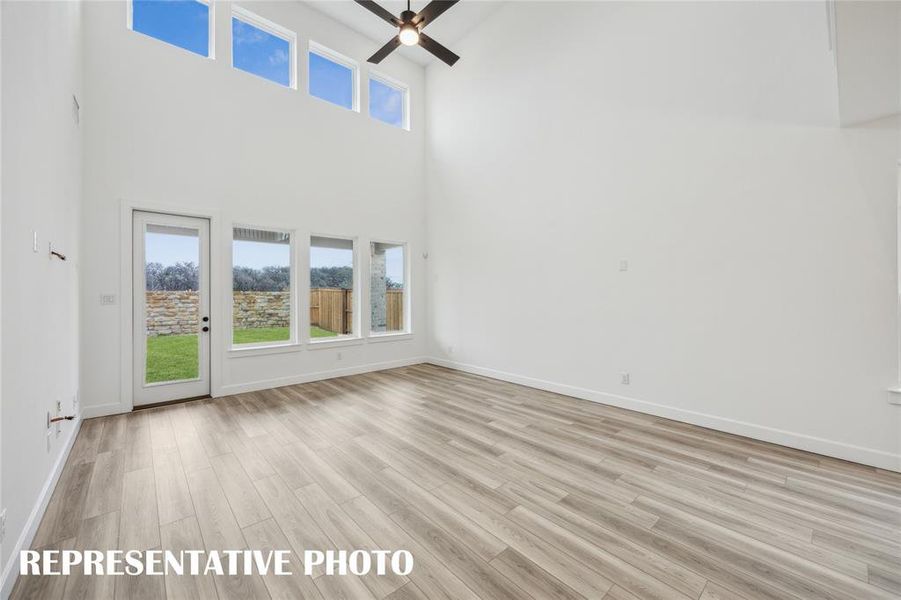 Light filled and inviting, this spacious family room is the perfect place for you to host family gatherings.  REPRESENTATIVE PHOTO