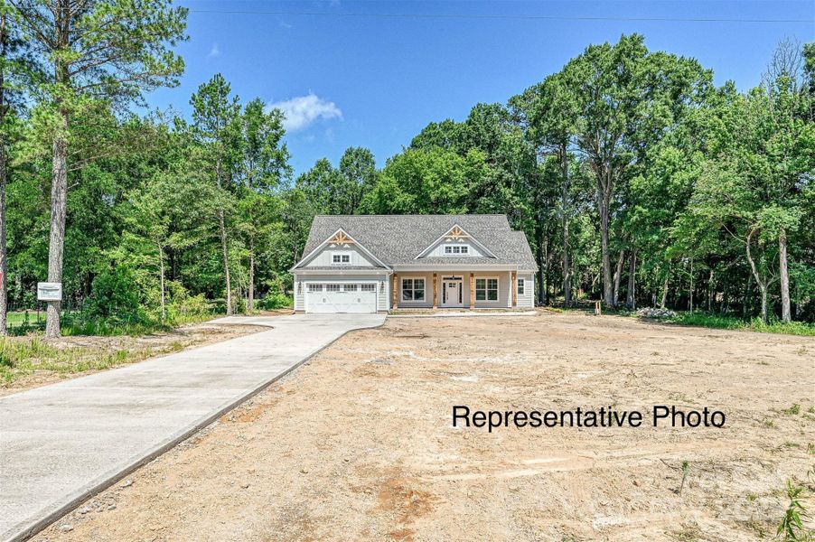 Front exterior of a new home in , Monroe, NC, highlighting curb appeal (Image 6).