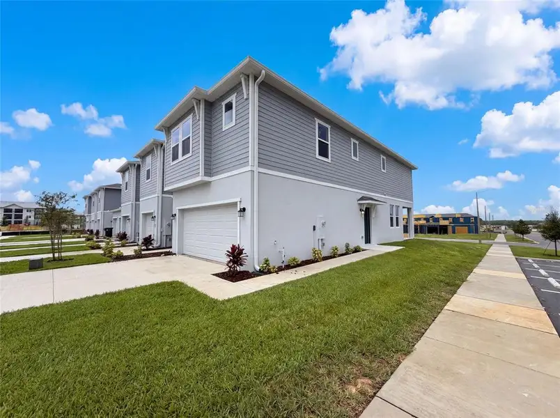 Front exterior of a new home in , Davenport, FL, highlighting curb appeal (Image 2). Front exterior of a new home in , Davenport, FL, highlighting curb appeal (Image 2).