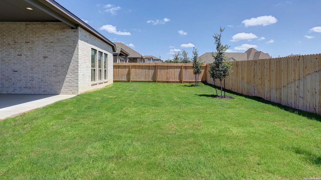Exterior details and patio area of a home in Kallison Ranch, San Antonio (Image 25).