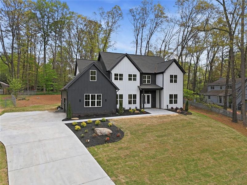 Front exterior of a new home in , Marietta, GA, highlighting curb appeal (Image 2). Front exterior of a new home in , Marietta, GA, highlighting curb appeal (Image 2).