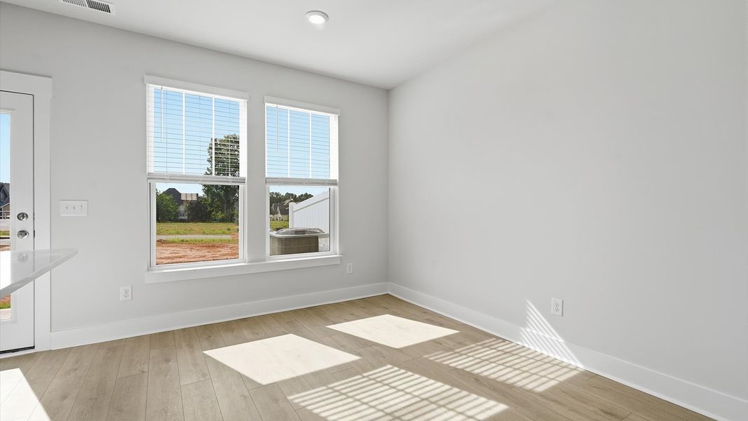Inviting breakfast area with a seamless connection to the kitchen for everyday living at Gresham Station