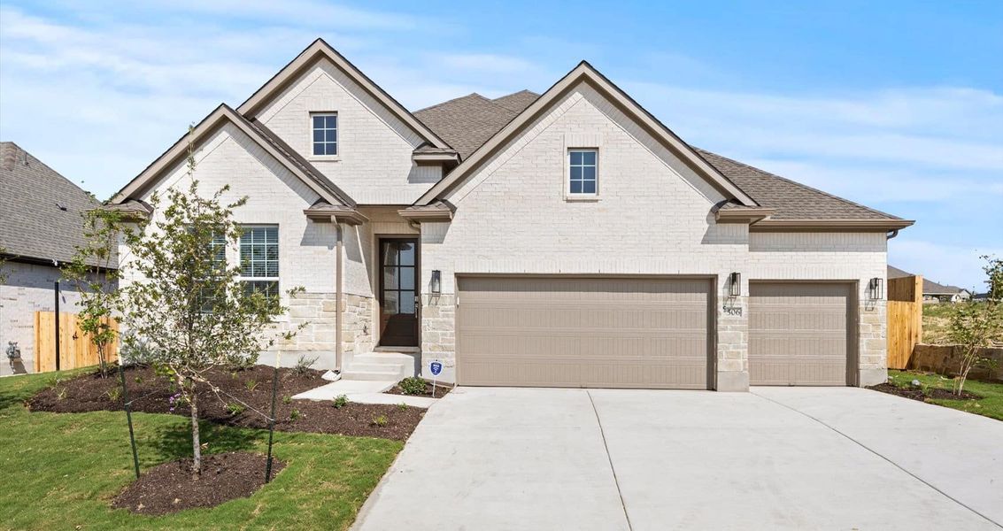 Representative exterior photo of a completed home built from the Wyatt by Chesmar Homes in Sunfield, Buda, TX (Image 1).