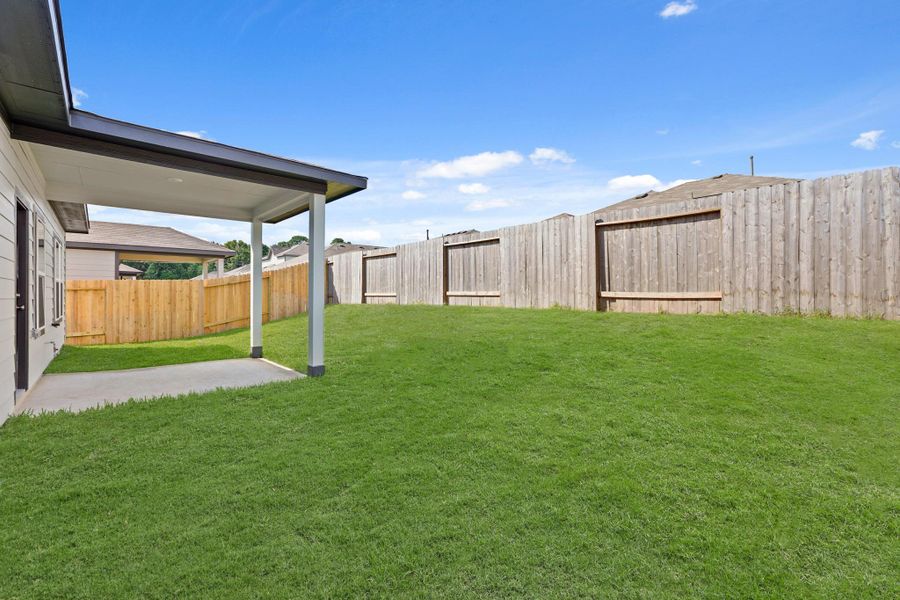 Exterior details and patio area of a home in Lexington Heights, Willis (Image 3). Exterior details and patio area of a home in Lexington Heights, Willis (Image 3).